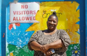 Caregiver Sandisa Menera outside of Enkululekweni primary in Wallacedene on 18 January, 2024. (Photo: Shelley Christians)